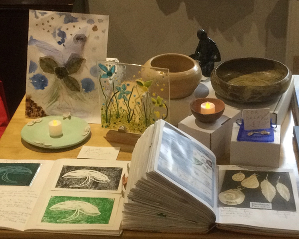 Handmade glassware, wooded bowls, candle holders, pressed flowers, jewelry and sketches.
