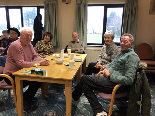 Brian, Jackie, Margaret and Roy seated at a table.