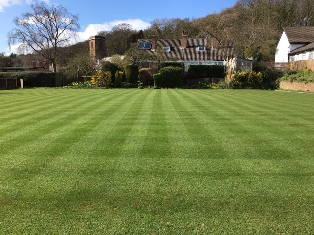 Picture of the green looking from the Clubhouse to the Church.