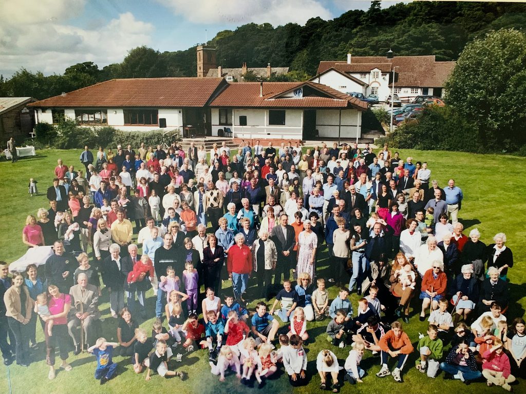 Picture of many people standing on the GVH field. Taken in 2000.