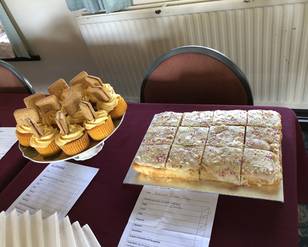 Custard cream cupcakes and a school tray cake.