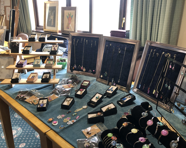 A table with a display of jewellry.